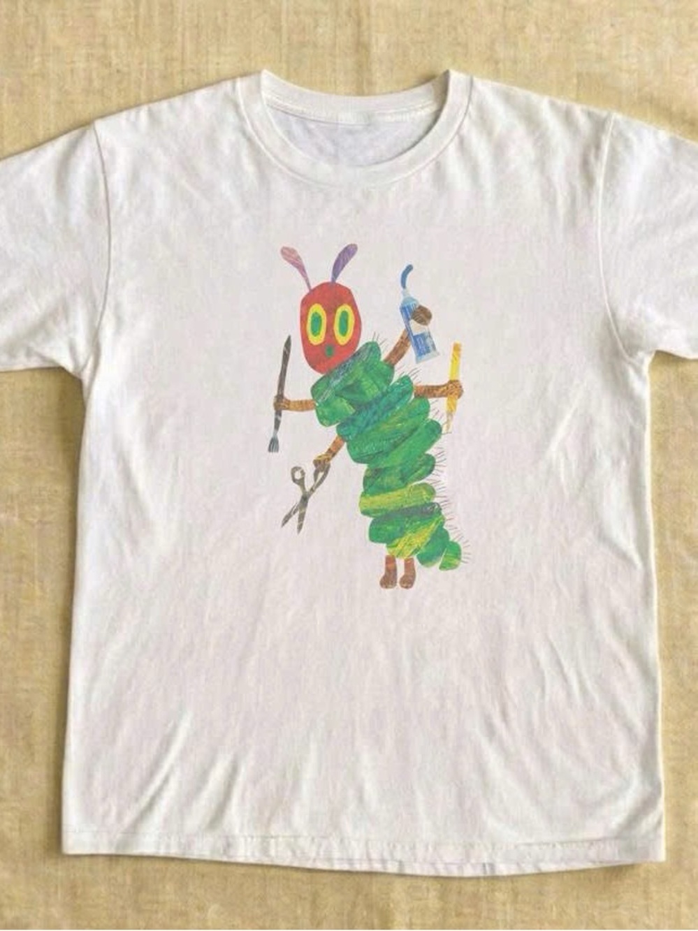 White Tee with Colorful Caterpillar Graphic